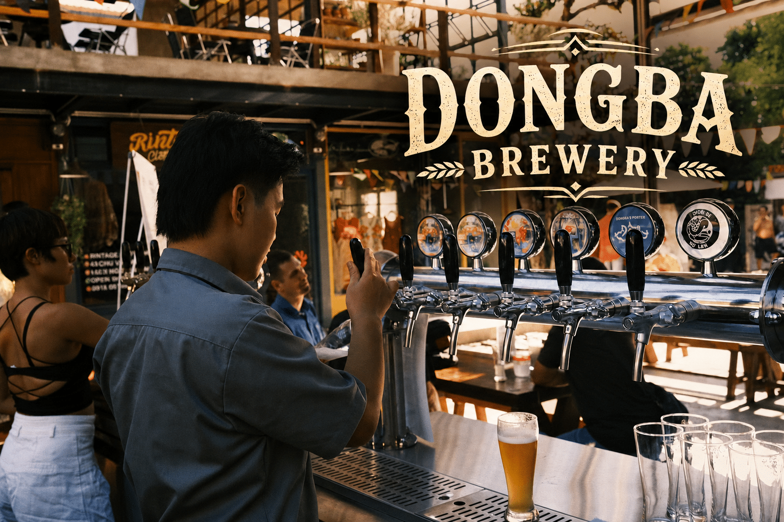 A guest photographing Đông Ba branded craft beer taps
