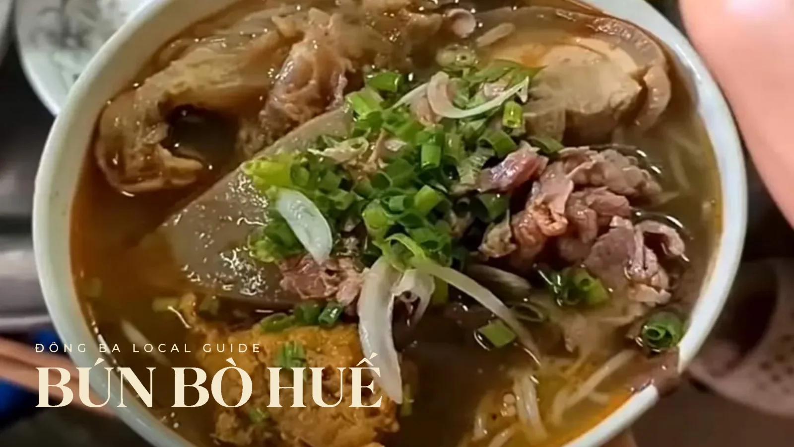 A real bowl of bún bò Huế with meat, onion and broth