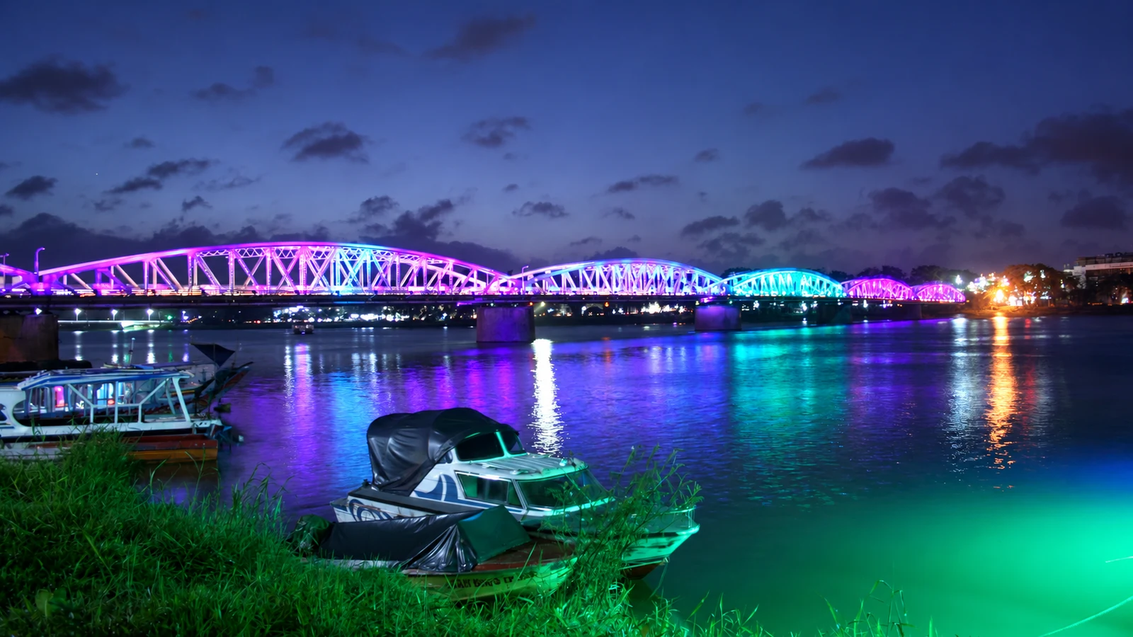 Trường Tiền Bridge lights and boats on the Perfume River at night