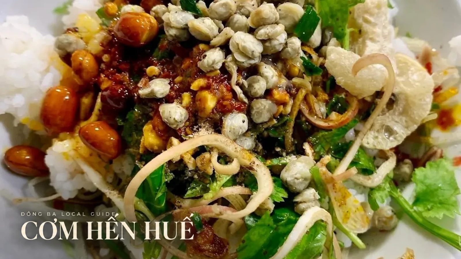 Cơm hến with rice, clams, herbs and peanuts in Huế